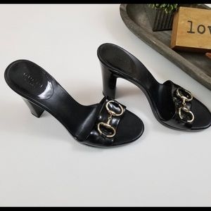 Gucci black patent leather horsebit mules slides